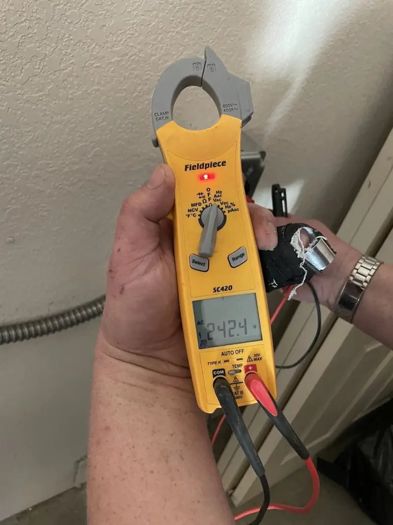 Voltage testing with clamp meter during Electrical Installation Services in Newark